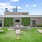 a patio with a lawn benches and corn hole