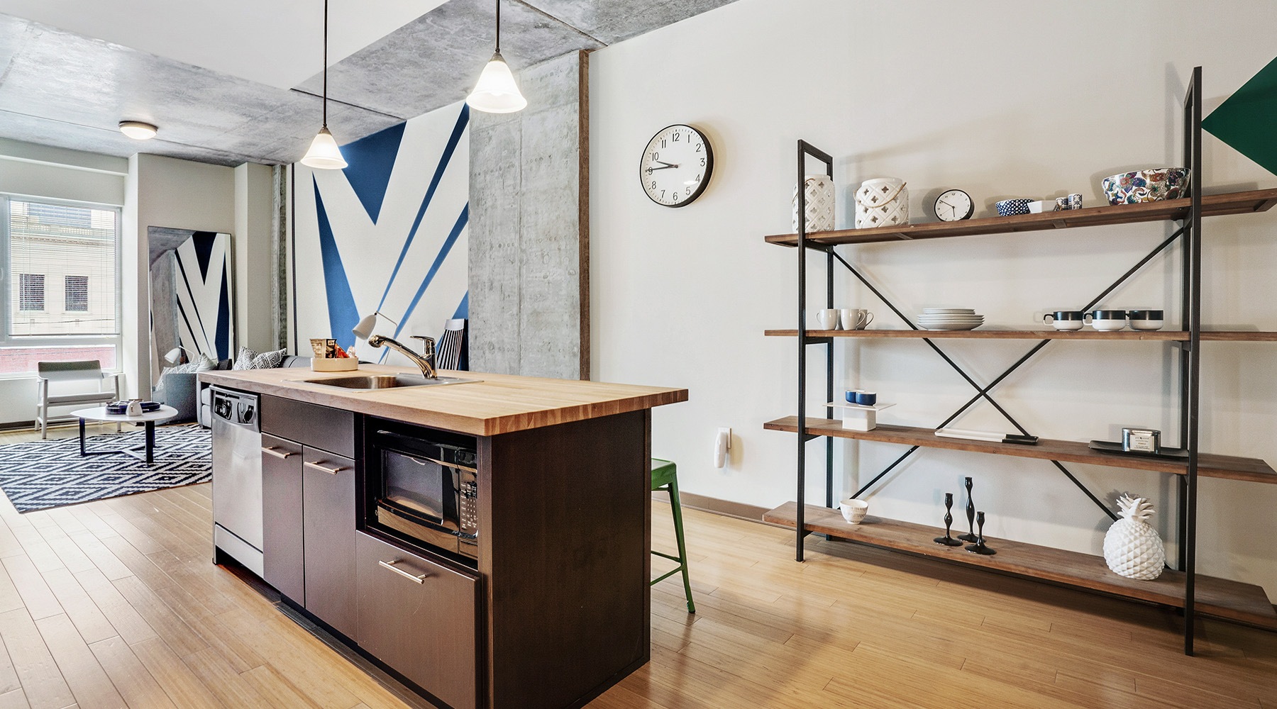 Beautiful kitchens with designer finishes a kitchen with an island and book shelf