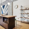 a kitchen with an island and book shelf